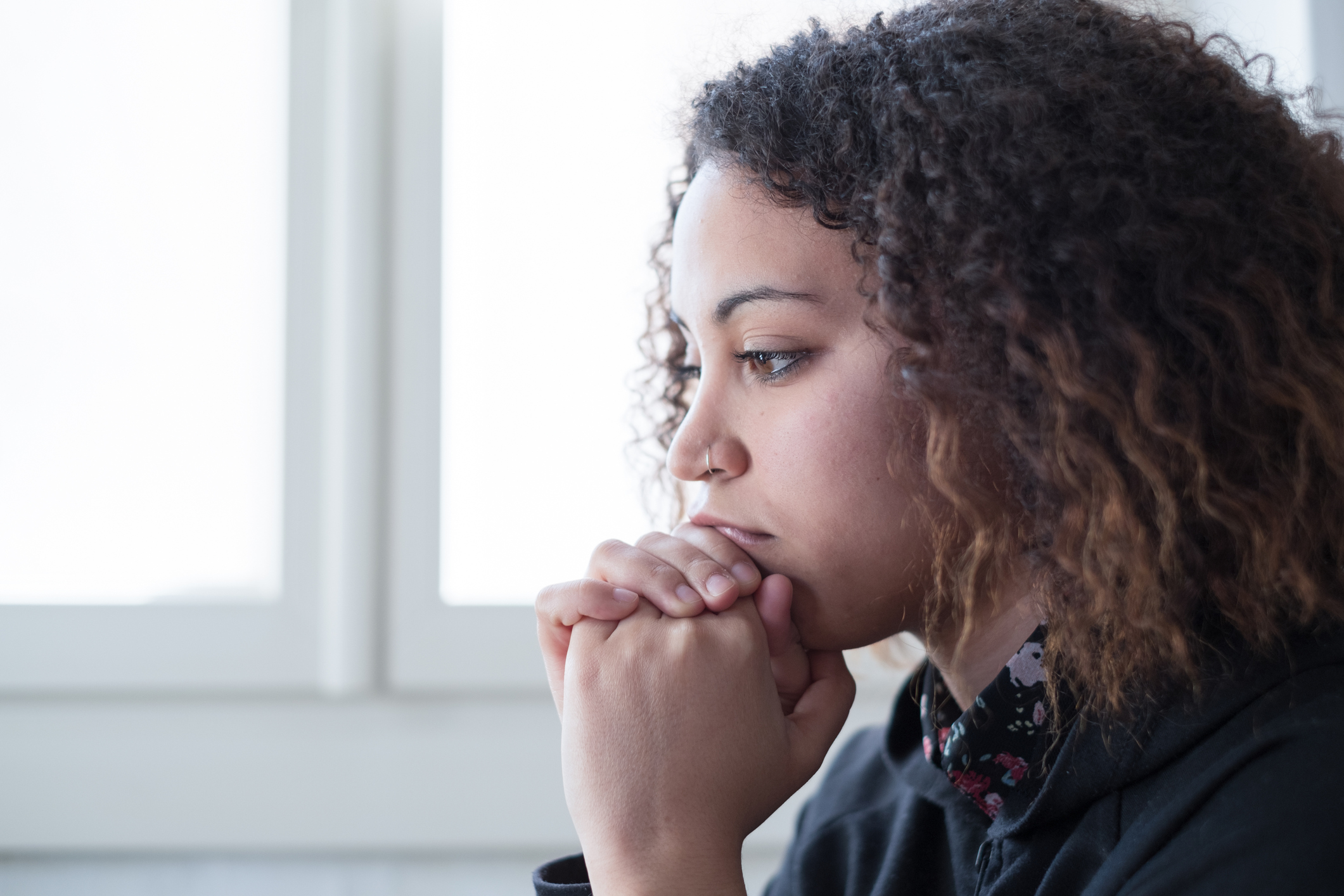 "Grief and loss". A lonely young woman feeling sad.