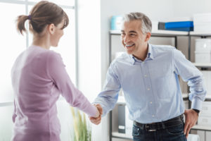 "The Clinical Psychology Residency Program". A therapist shakes hands with a middle-aged supervisor.
