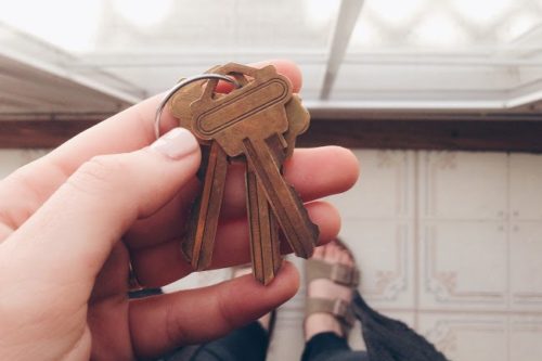 Close up point of view while checking house keys before opening the door.